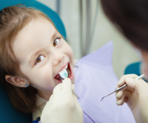 Little Girl Receiving Dental Care 