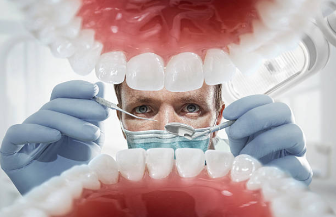 Dentist Examining a Patient's Mouth