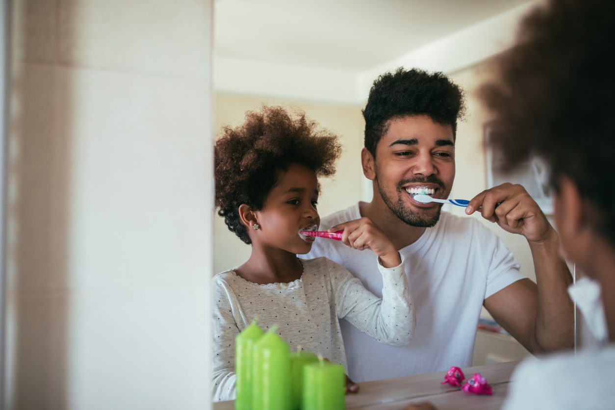 Father and Son Brushing Teeth